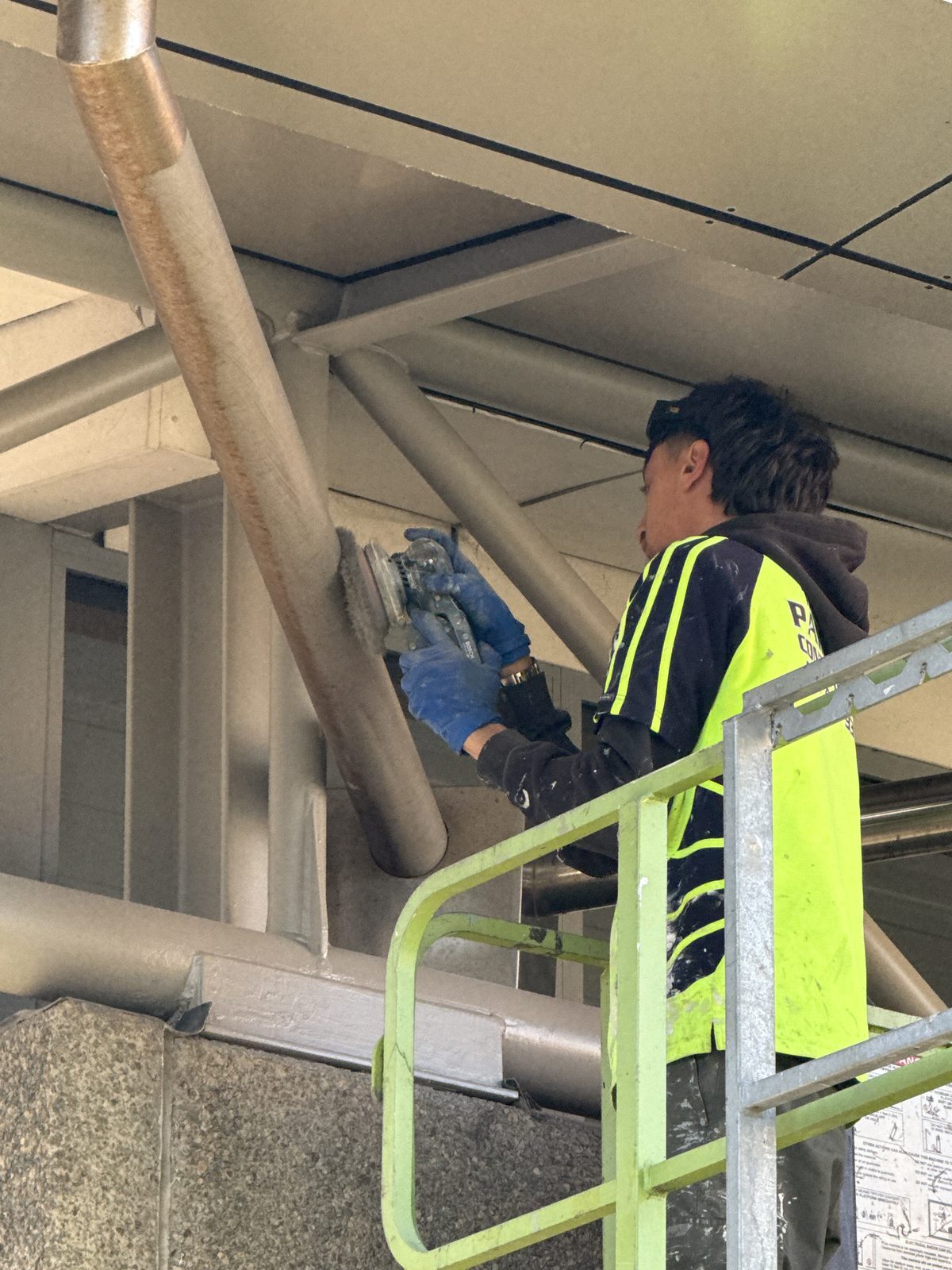 Working at height applying Carboline epoxy rust treatment to steelwork at St Peter’s Church, Tauranga
