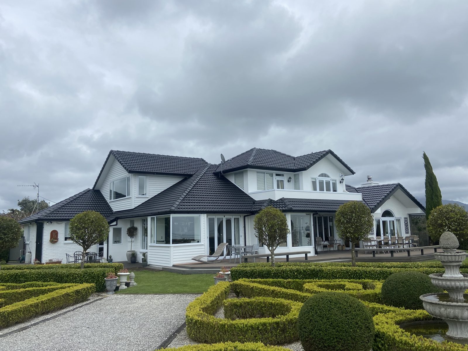 After roof painting — charcoal recoated roof on a Tauranga house